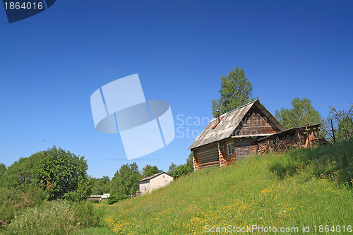 Image of rural house on small hill