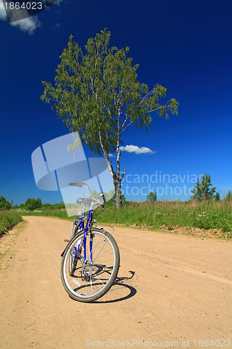 Image of bicycle on rural sandy road