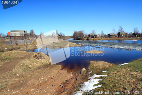 Image of village on coast autumn river