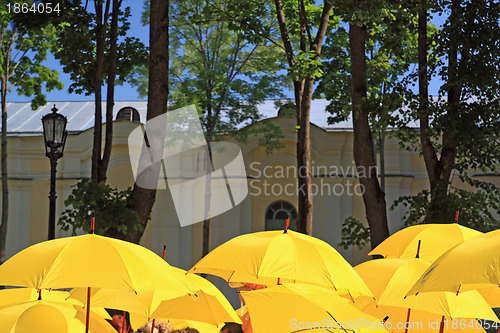 Image of yellow umbrellas on town street