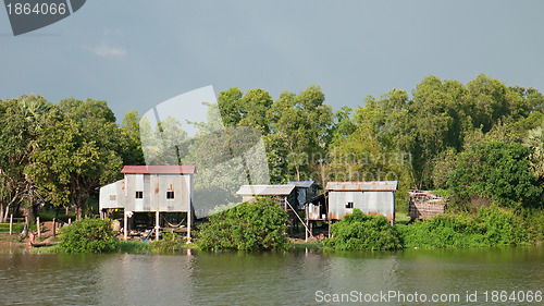 Image of Farmhouses at river bank in Cambodia