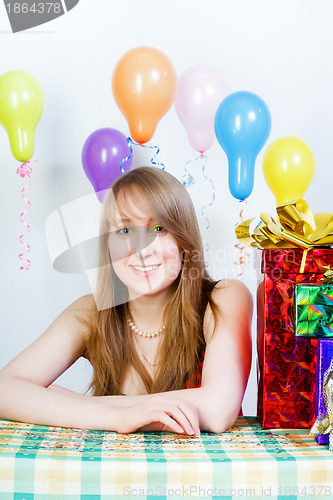 Image of Happy birthday. Attractive young girl with gifts