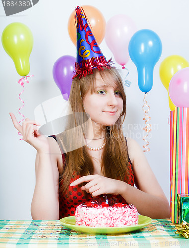 Image of Happy birthday. Attractive young girl with cake