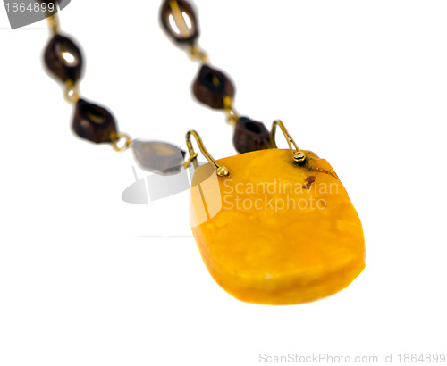 Image of Big amber stone necklace isolated on white 