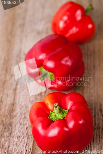 Image of three red bell peppers 