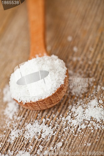 Image of cooking salt in wooden spoon