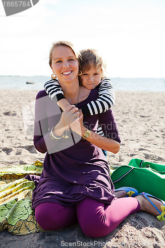 Image of Mother and son at beach.