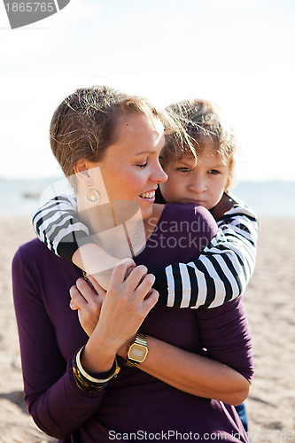Image of Mother and son at beach.
