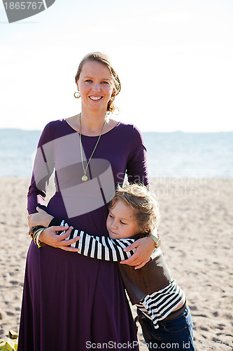 Image of Mother and son at beach.