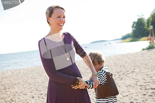 Image of Mother and son at beach.