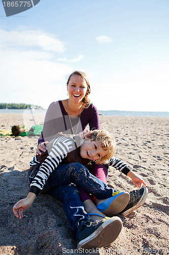 Image of Mother and son at beach.