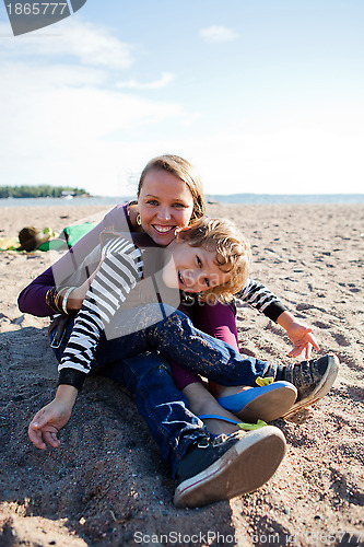 Image of Mother and son at beach.