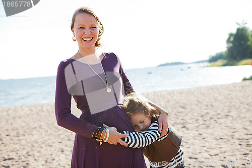Image of Mother and son at beach.