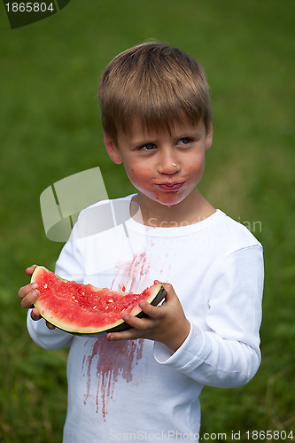 Image of Child eating a watermelon