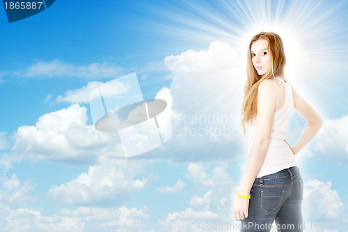 Image of redheaded girl and solar sky