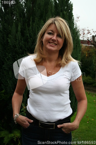 Image of Lovely girl standing in the garden