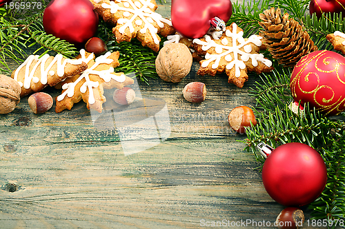 Image of Gingerbread cookies with fir cones and Christmas toys.