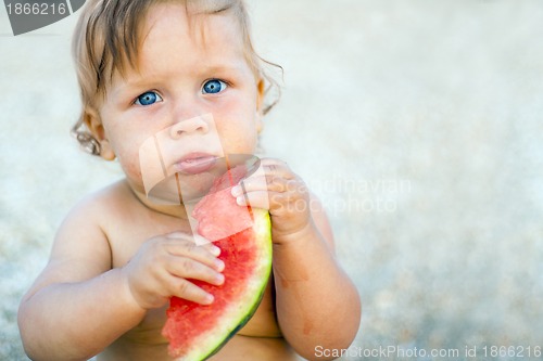 Image of baby eating watermelon