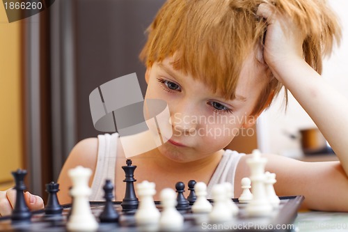 Image of Boy playing chess