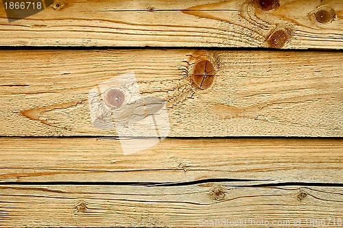 Image of Parallel wooden cracked logs close up