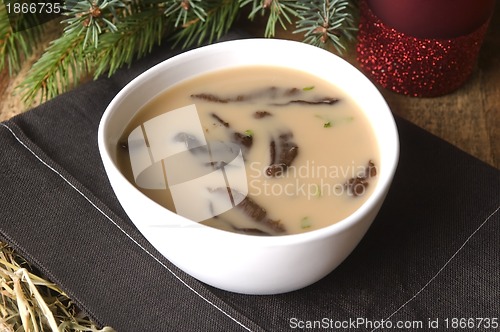 Image of Traditional polish mushroom soup with cream and vegetables