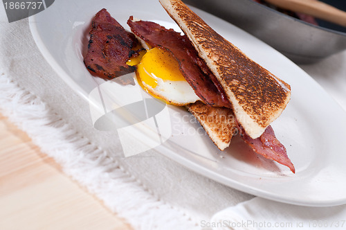 Image of eggs bacon and toast bread