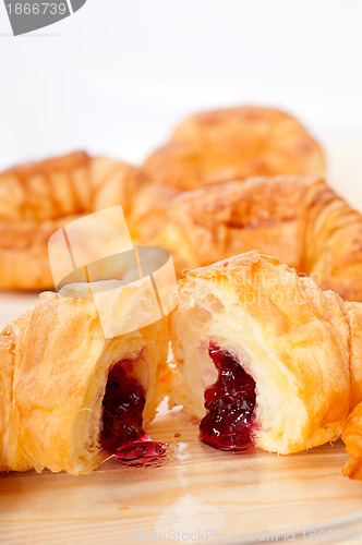 Image of croissant French brioche filled with berries jam