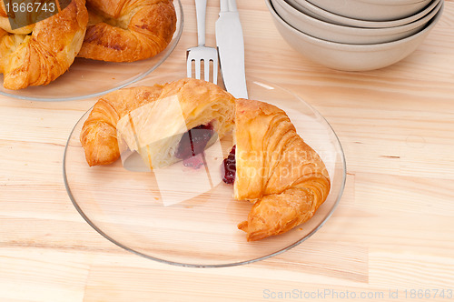 Image of croissant French brioche filled with berries jam