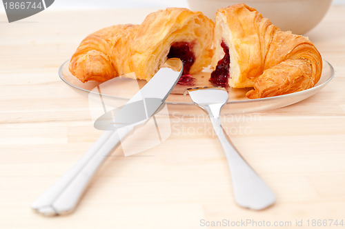 Image of croissant French brioche filled with berries jam