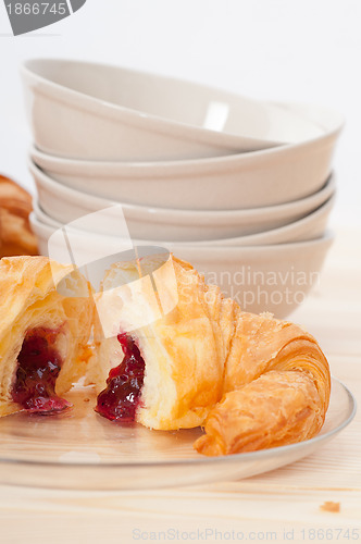 Image of croissant French brioche filled with berries jam