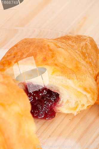 Image of croissant French brioche filled with berries jam