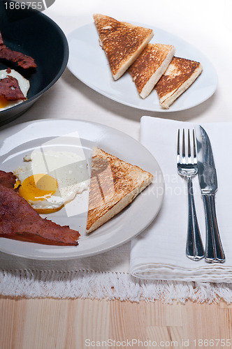 Image of eggs bacon and toast bread