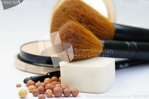 Image of Makeup foundation, powder, bronzer and brushes