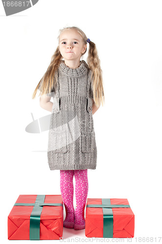 Image of Beautiful girl with two christmas presents