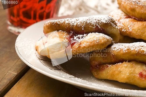 Image of Dough with marmelade on wooden board