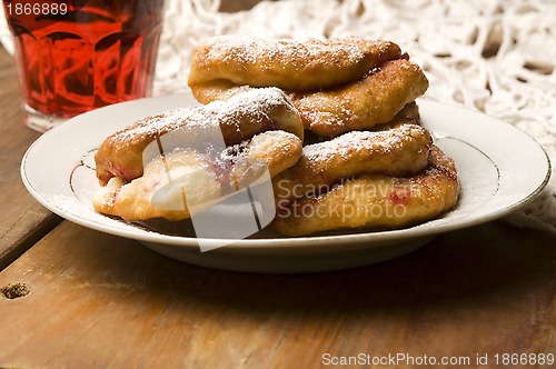 Image of Dough with marmelade on wooden board