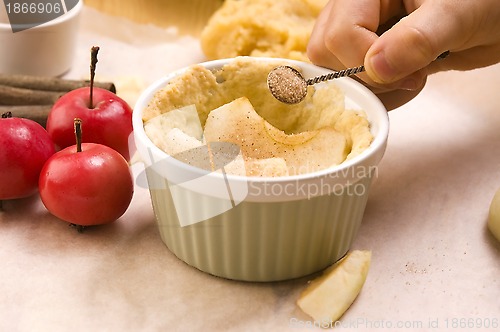 Image of Detail of child hands making apple pie