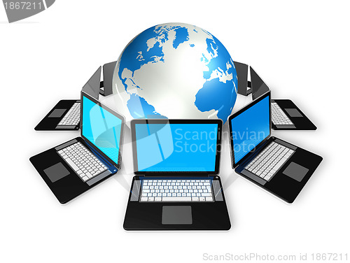 Image of Laptop computers around a world globe