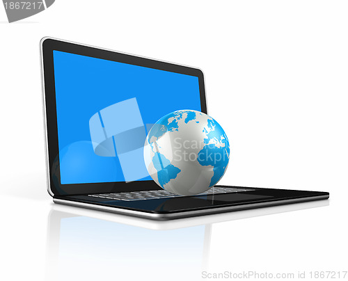 Image of World globe, map on a laptop