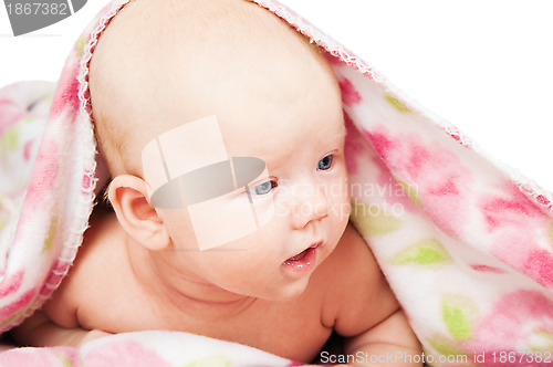 Image of Little baby under multicolored towel