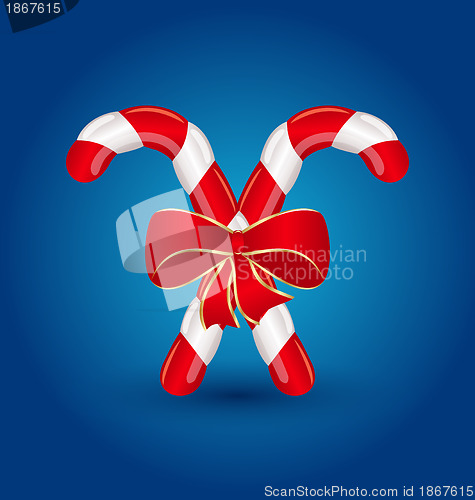 Image of Christmas candy canes with red bow isolated