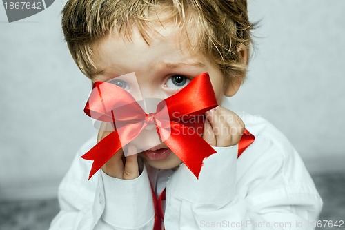 Image of Small baby with silver gift box