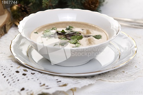 Image of Traditional polish mushroom soup with cream and vegetables