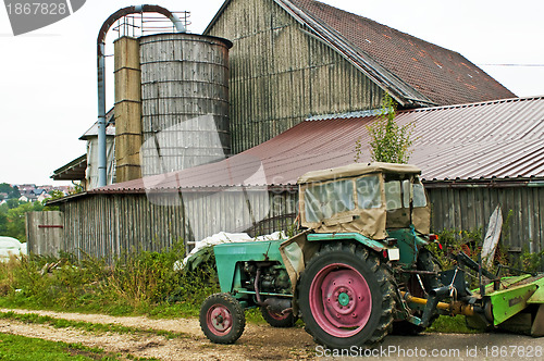 Image of old barn with silo and tractor