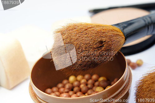 Image of Makeup foundation, powder, bronzer and brushes