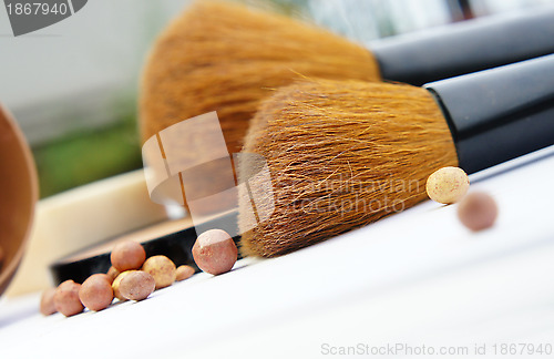 Image of Makeup foundation, powder, bronzer and brushes