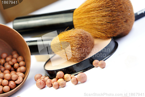 Image of Makeup foundation, powder, bronzer and brushes