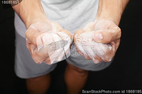 Image of Man using sports chalk