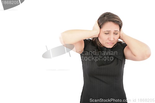 Image of Stressed young woman covering his ears, grimacing and gesturing 