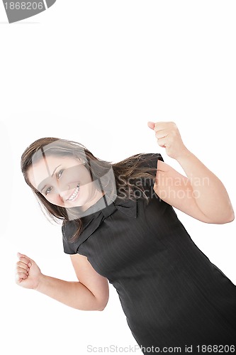 Image of Woman with orthodontics enjoying success with clenched fists